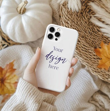 Phone case mockup held by a hand with pumpkins and leaves in the background